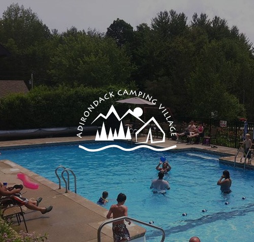 Logo for Adirondack Camping Village with a swimming pool in the background.