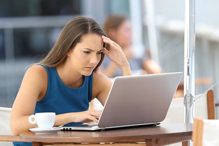 Woman searching online and concerned about her website's search engine ranking