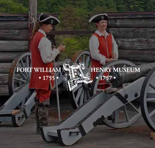 Revolutionary War soldiers in period dress next to cannon