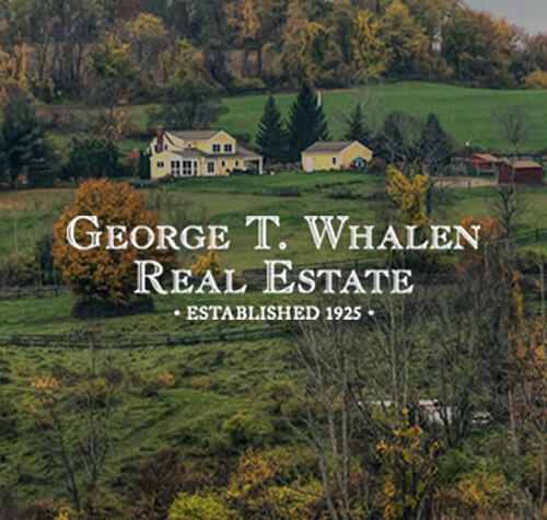 George T Whalen Real Estate logo with a house in the background.