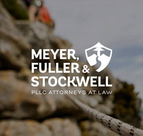 Meyer, Fuller, and Stockwell Attorneys logo with a mountain in the background.
