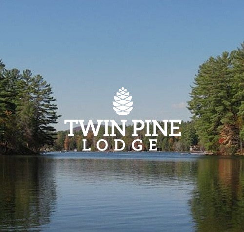 Twin Pine Lodge logo with a lake in the background.
