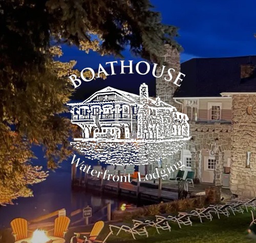 Boathouse Waterfront Lodging logo with their lodge in the background.