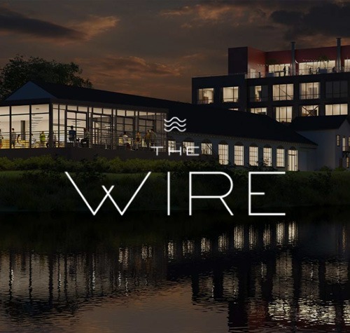 The Wire logo with the property in the background.