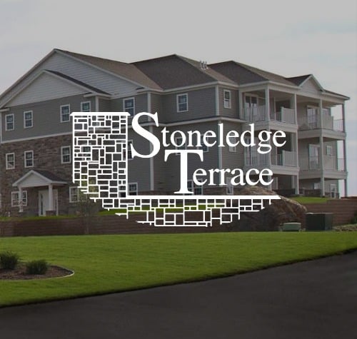 Stoneledge Terrace logo with the property in the background.