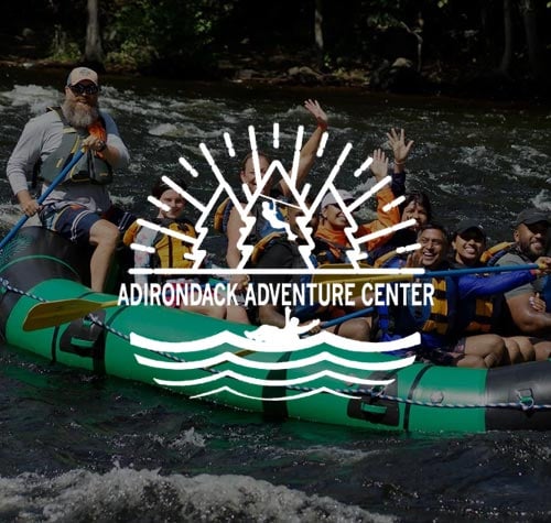 Adirondack Adventure Center logo with a kayaking group in the background.